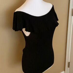 Black ruffle bib top. Off shoulder.